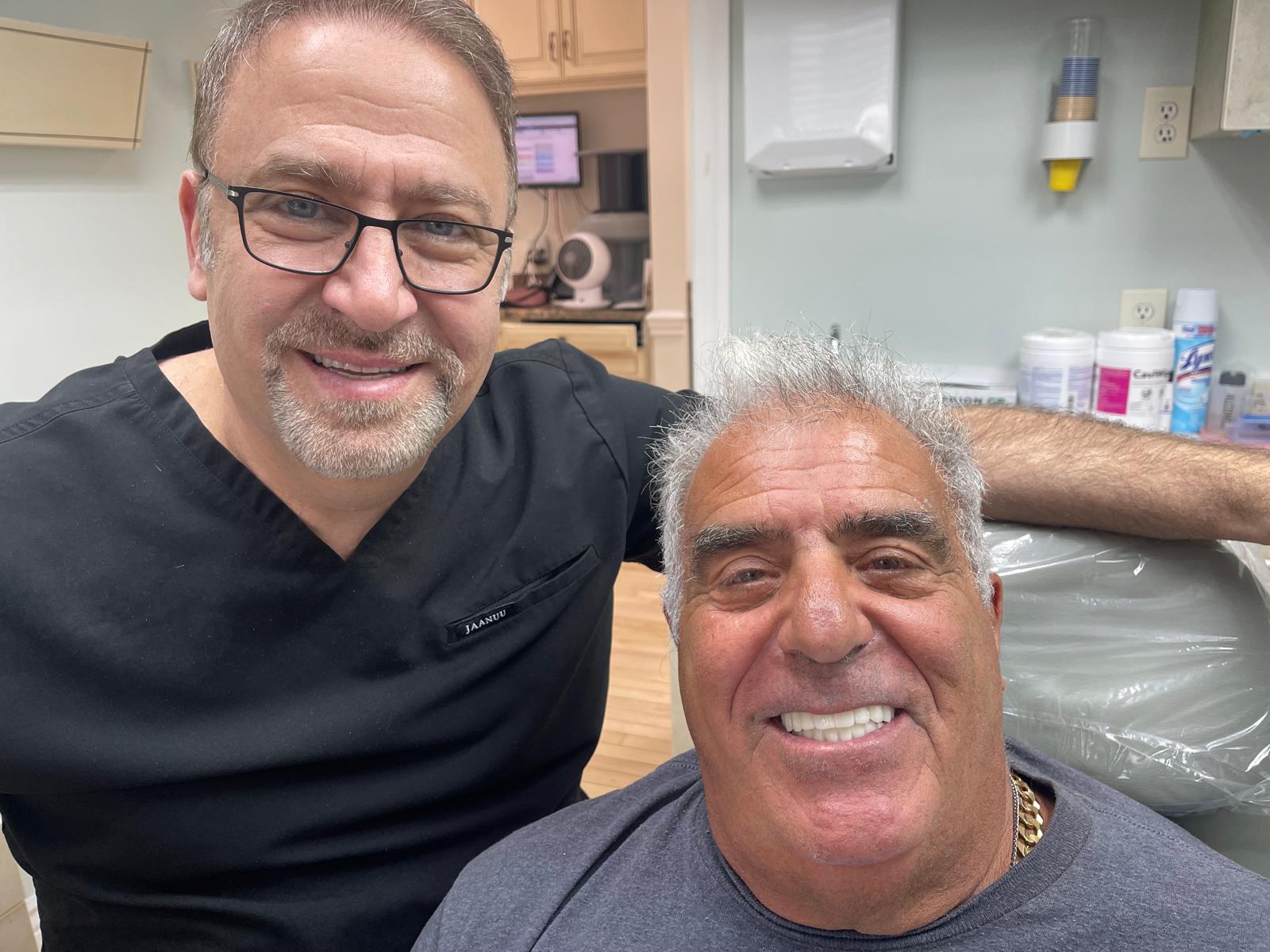 Dr. Tinawi with a patient after completing dental treatment